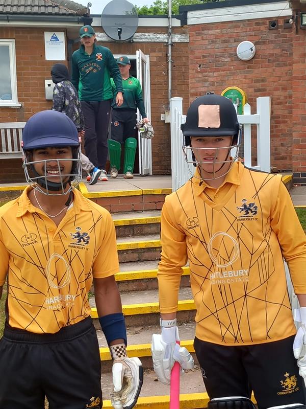 Ombersley cricketers waiting to go out  to bat